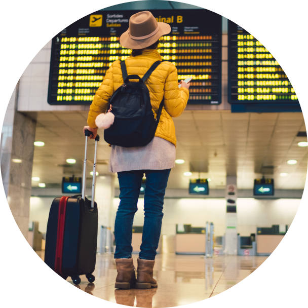 Person checking flight times at the airport