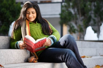 Student reading a textbook