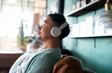 Person relaxing with headphones on