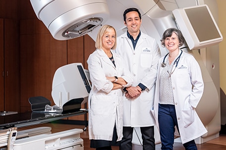 Three doctors smiling together