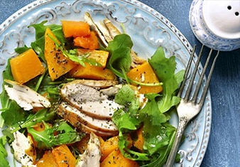 Citrus salad on blue plate and tablecloth