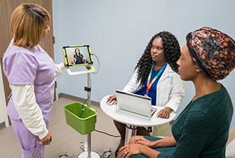 Patient talking to care team