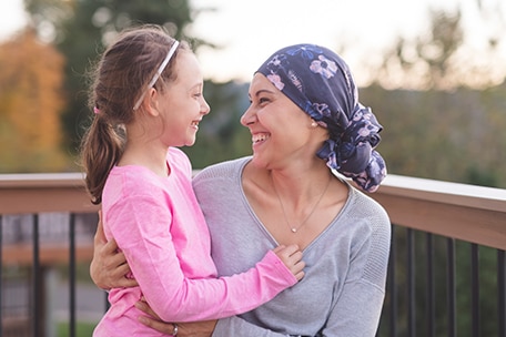 Parent and child hugging and smiling