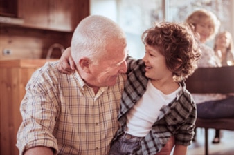 Older person hugging grandchild