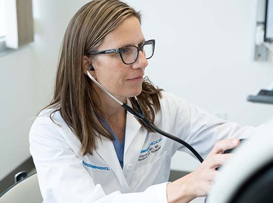 Kaiser Permanente physician examining a patient