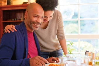 Couple preparing to eat a meal together