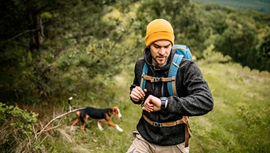 Person hiking with dog