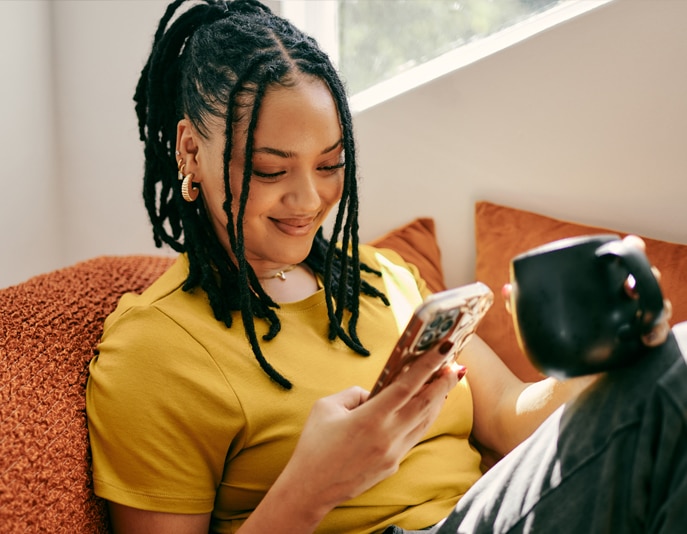 Person smiling looking at phone