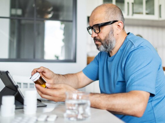 Person ordering prescriptions online at home