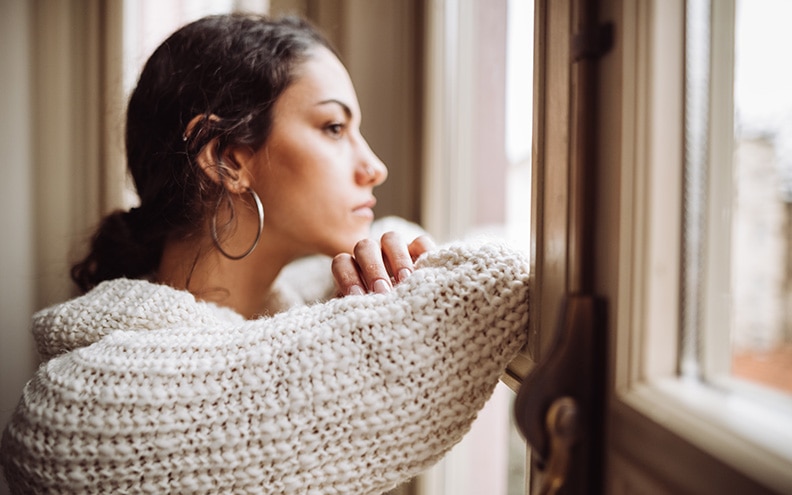Person looking out a window