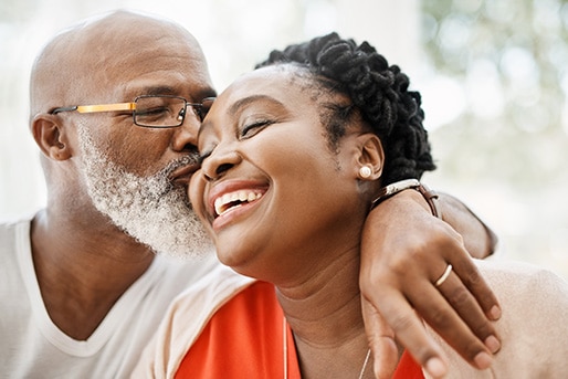 adult and child dancing and laughing together