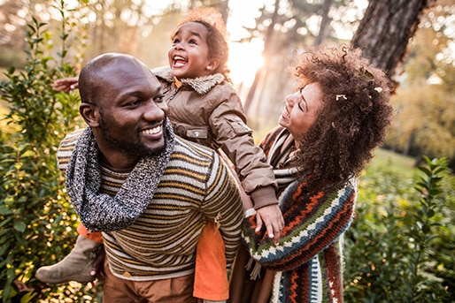 adult and child dancing and laughing together