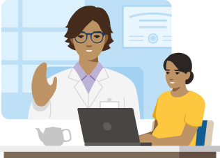 Pregnant person using a laptop for a video visit with their doctor