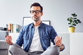 Person meditating in lotus position