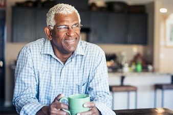 Person smiling with coffee