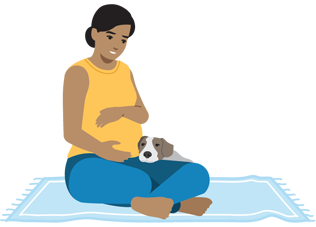 Pregnant person sitting with their dog