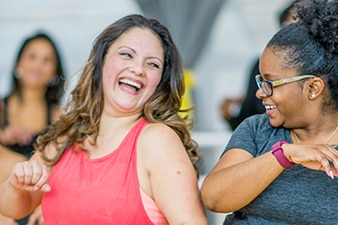 Friends laughing in an exercise class