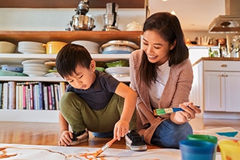 Parent and child painting a picture