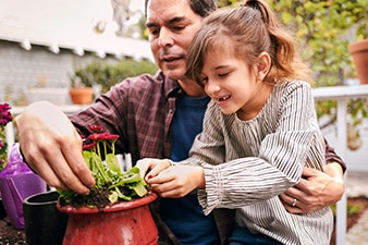  Parent and child potting a plant