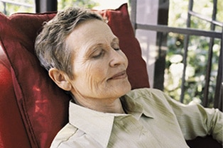 Person sleeping in a chair.