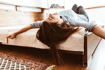 Person sleeping on a bed.