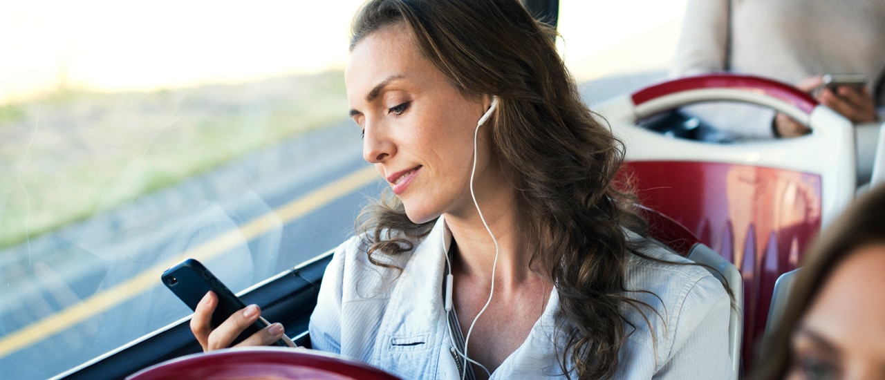 woman with iphone on train