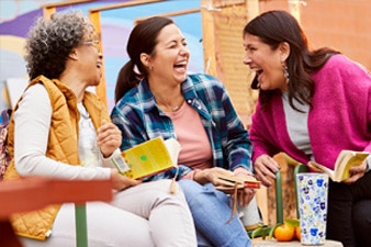 Laughing group of friends at book club