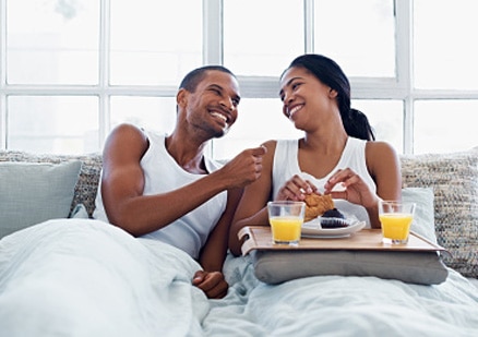couple eating in bed