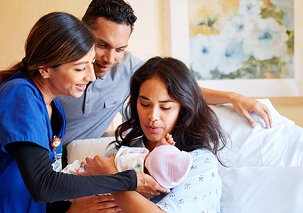 Family with newborn baby in hospital