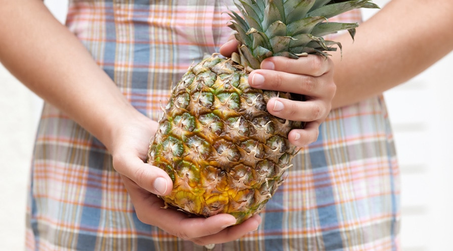 handa holding a pineapple