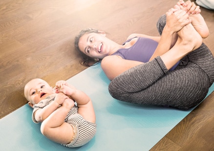 mom and baby stretching