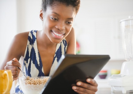 woman eating bowl of cereal