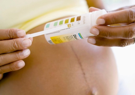 pregnant woman with medical test in her hands