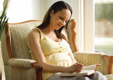 woman writing in notebook