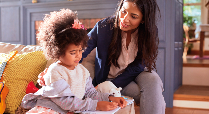 Woman and daughter sitting