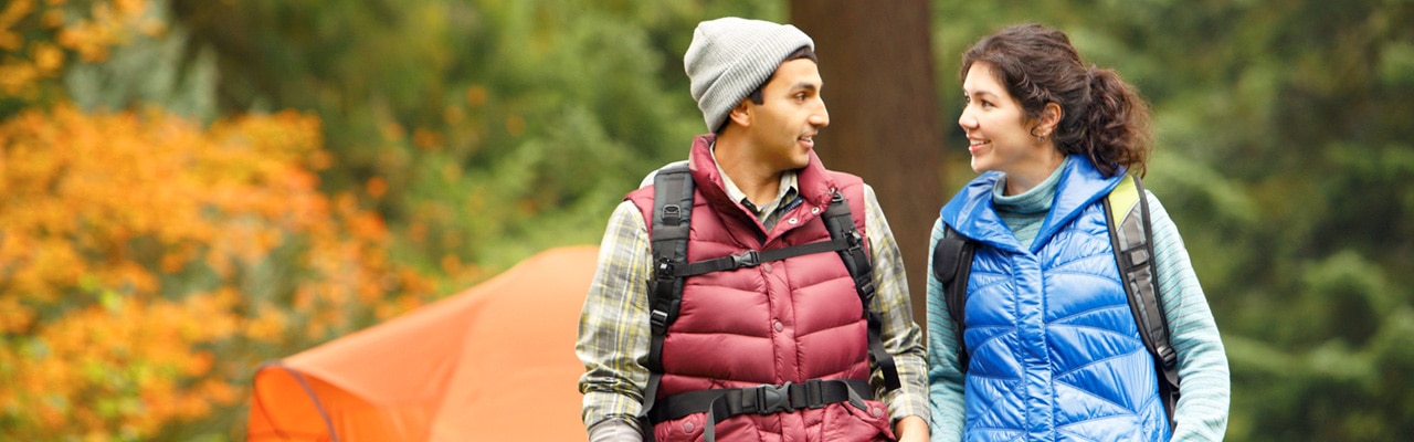 young couple relax while hiking together and talking