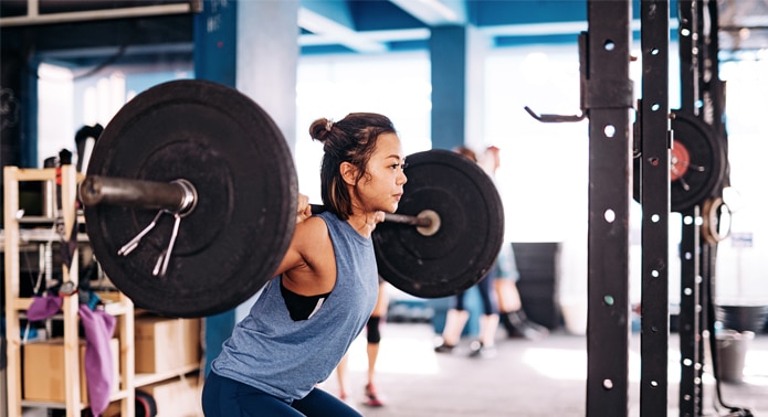 Person lifting weights in a gym