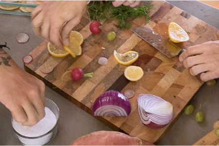 Group of adults making dinner together