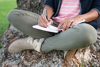 Person writing in a journal