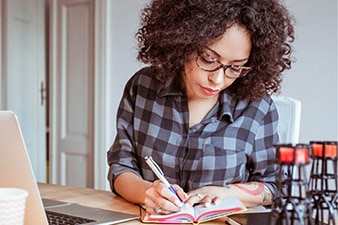 Person writing in a notebook