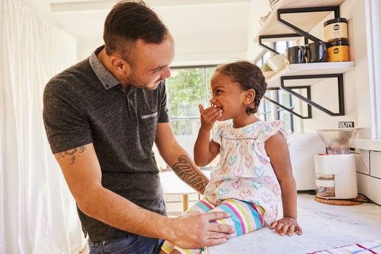 Father and daughter laughing