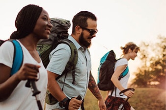 Smiling group of friends hiking outside