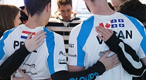 Soccer team in tight huddle