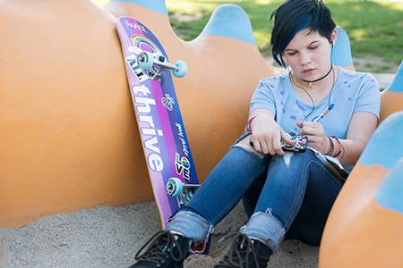 Teenager writing in their journal