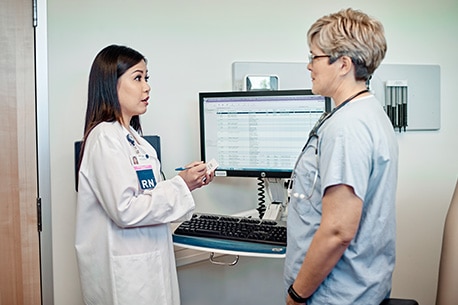Doctor speaking with colleague