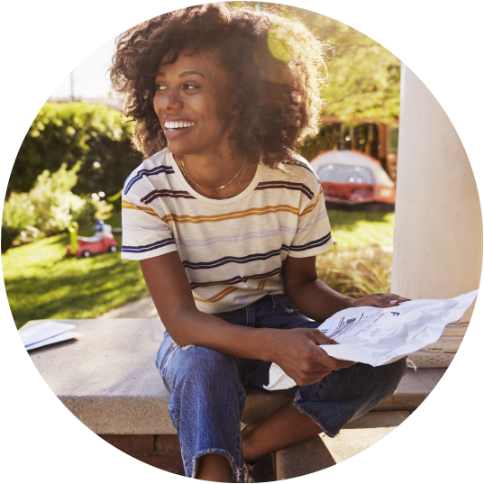 Person holding a package and smiling