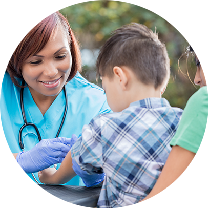 Clinician giving a shot to a child