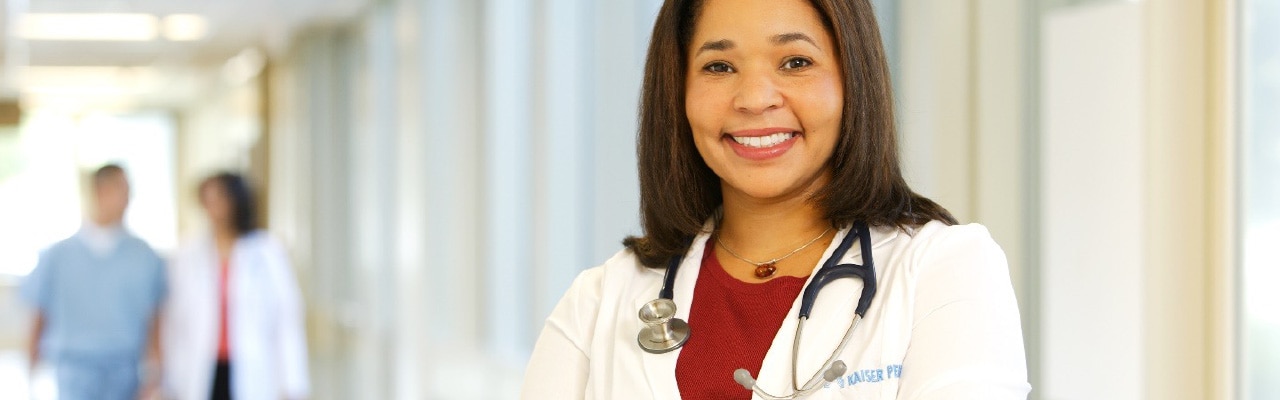 Doctor smiles in hallway