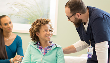 Nurse speaking with young patient