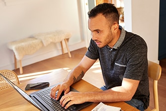 Person doing research using a laptop